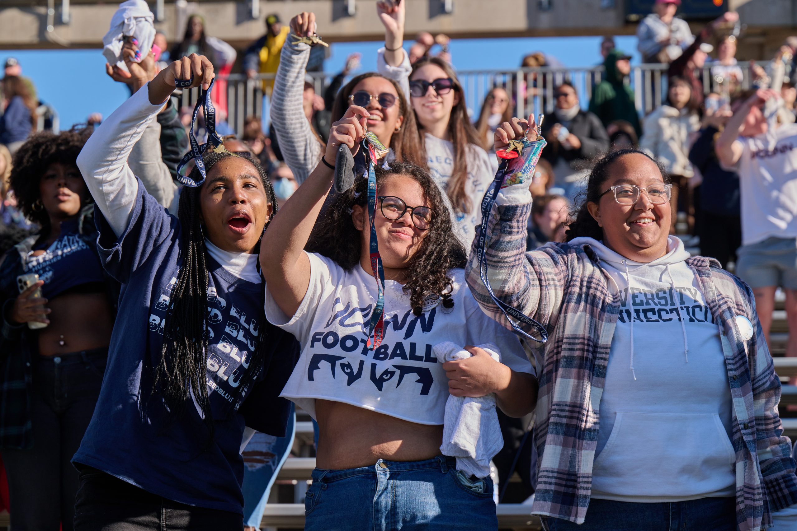 Student cheering at UConn football game
